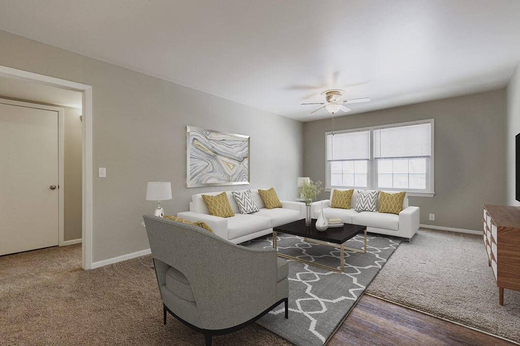 an open living room with couches and a coffee table