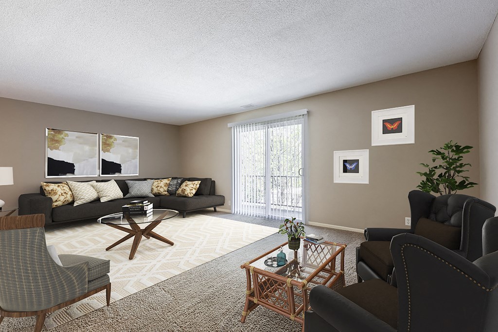 a living room with a couch and a chair and a table