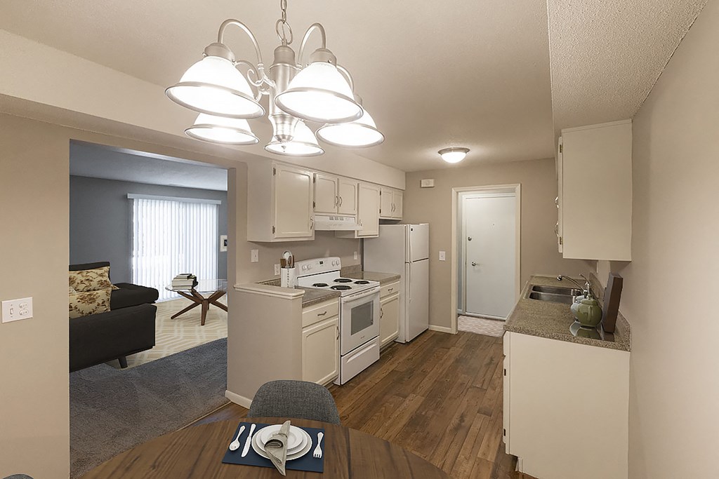 a view of a kitchen and living room in an apartment