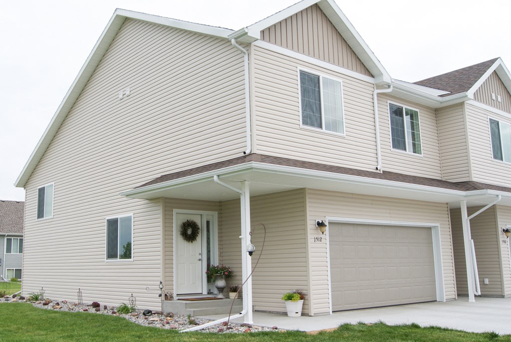 the front of a house with a garage door