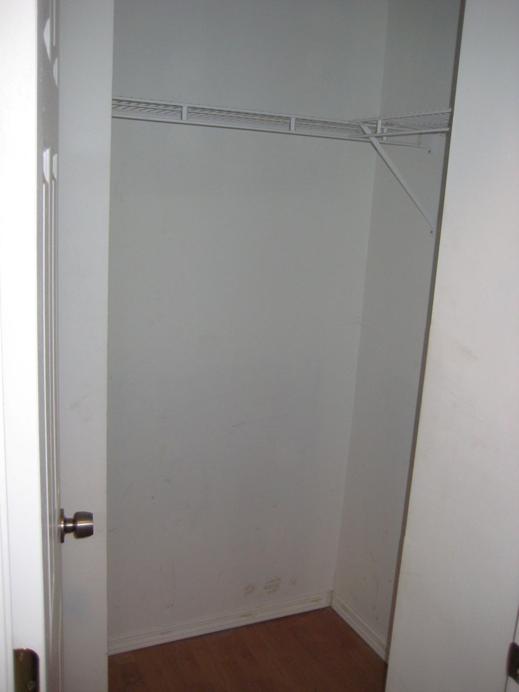 the door to the closet in the bathroom is open