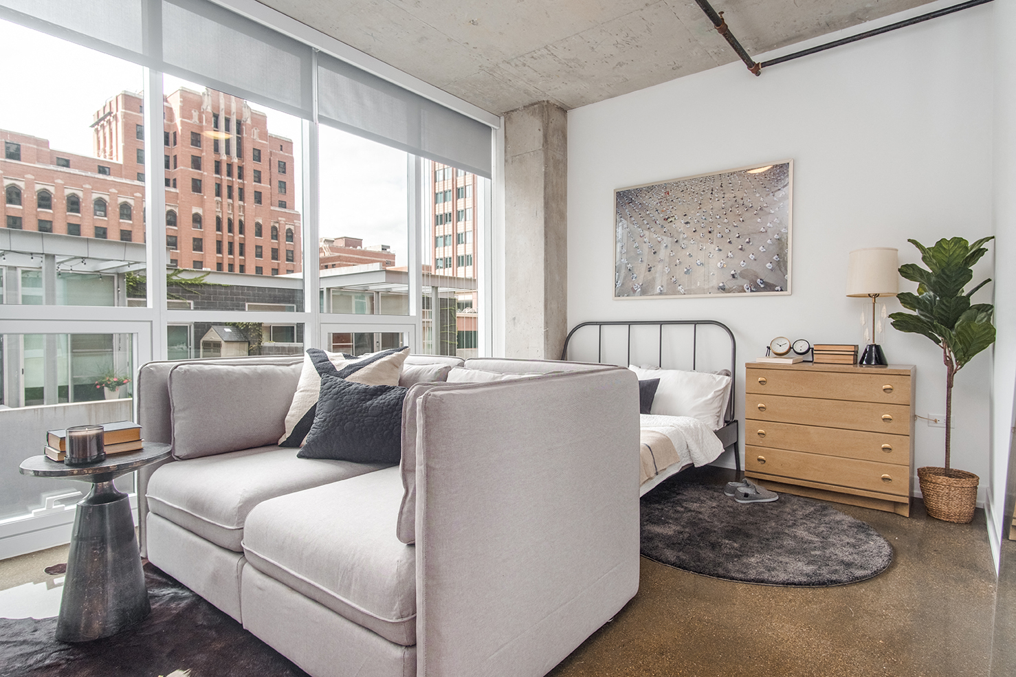 a living room with a couch and a large window