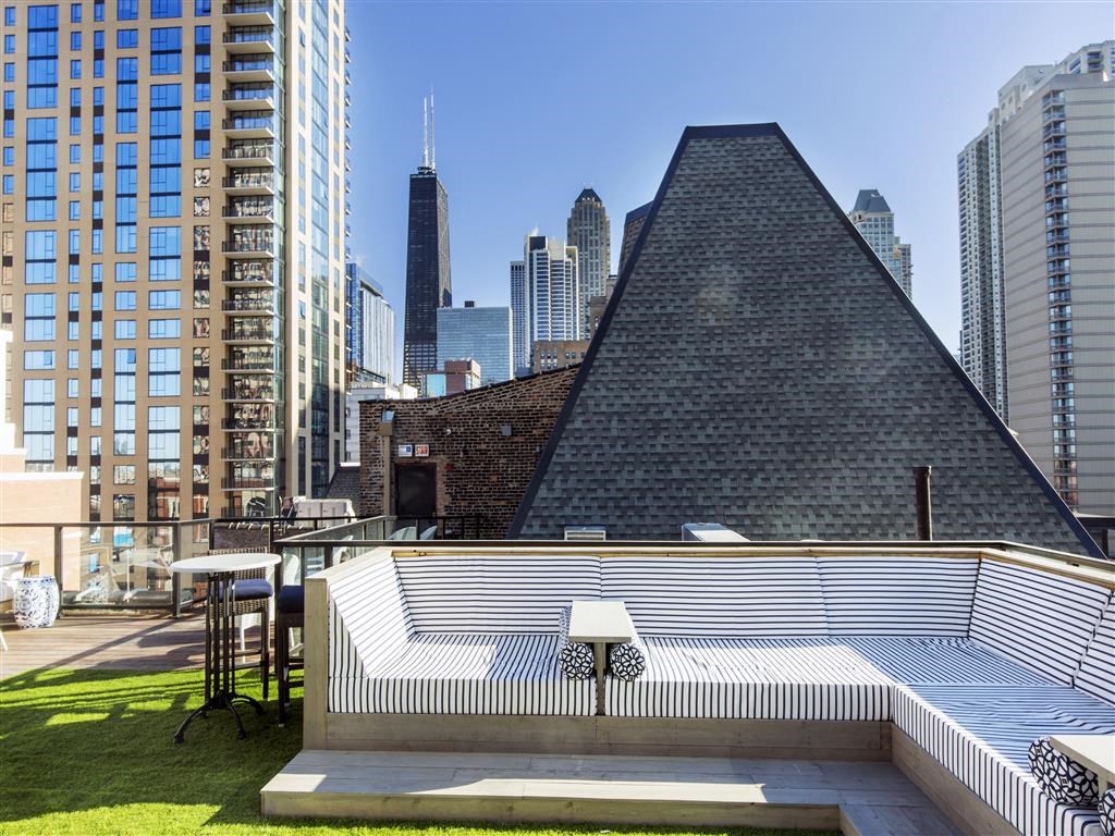 the pool on the roof of the building has views of the city