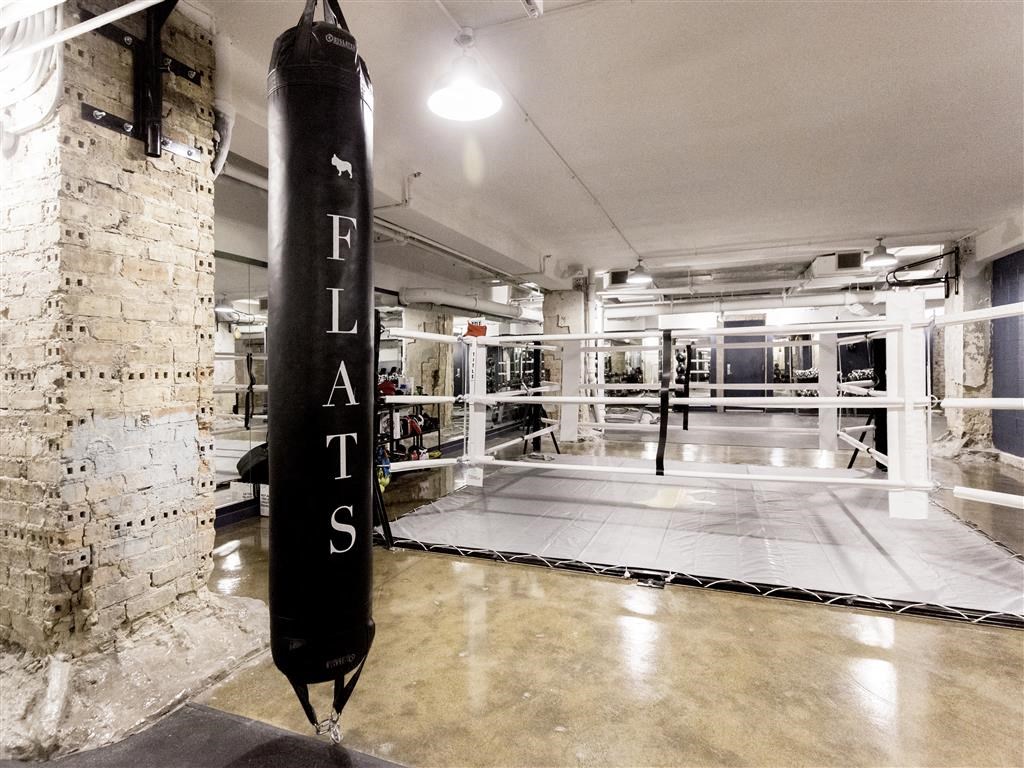a punching bag in a gym with a brick wall