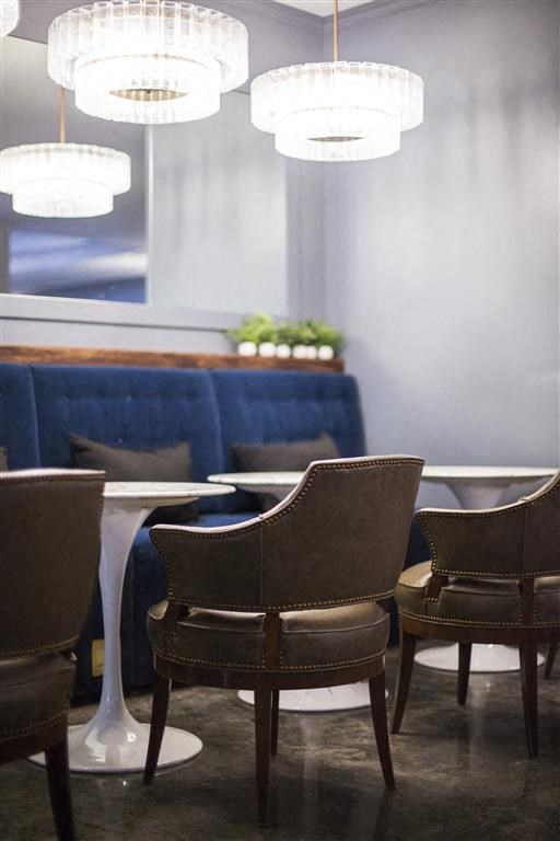 a dining room with chairs and a table