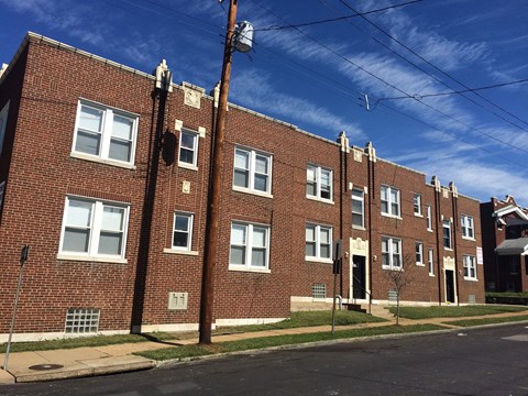 a brick apartment building on a city street
