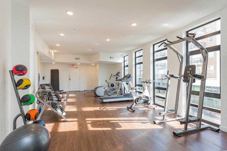 a workout room with weights and other exercise equipment