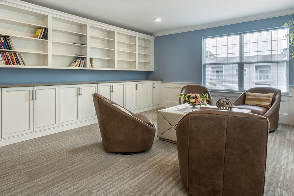 a living room with two chairs and a table