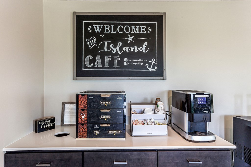 a coffee table with a coffee machine and boxes on it