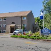 a building with a car parked in front of it