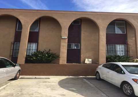 a building with cars parked in front of it