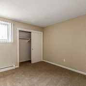 a empty room with a window and a door