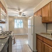 a kitchen with a stove and a refrigerator