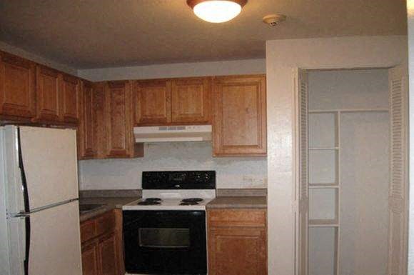 a kitchen with a stove and a refrigerator