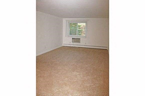 an empty room with a window in it