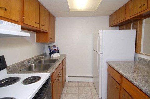 a kitchen with a stove and a refrigerator