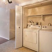 a white washer and dryer in a laundry room