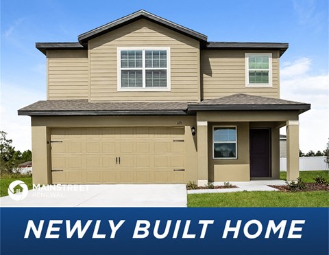 a tan house with the words newly built home
