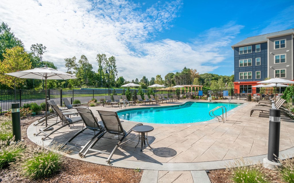 our apartments offer a swimming pool with chairs and umbrellas