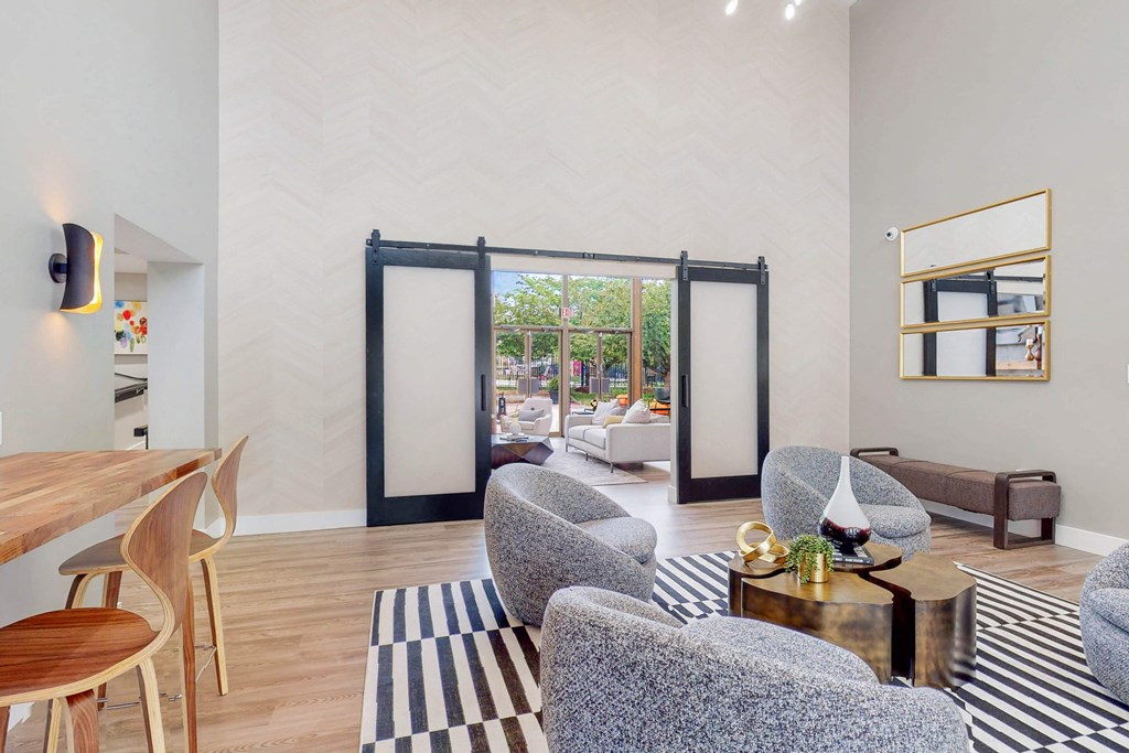 a living room with furniture and a sliding glass door to a patio