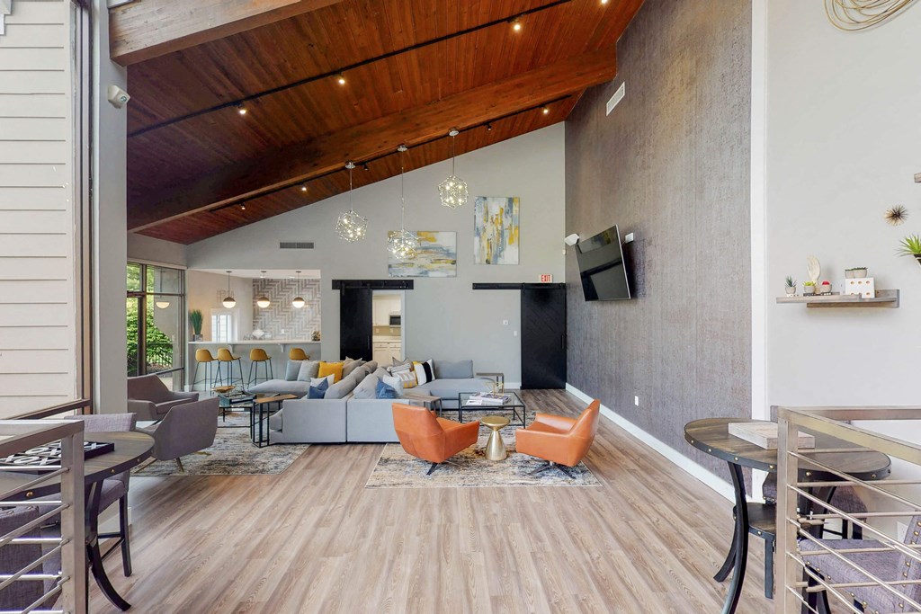 a living room with couches and chairs and a table