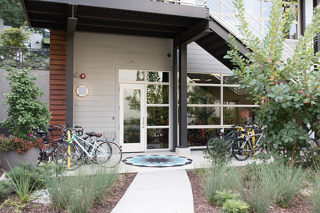 two bikes parked in front of a house