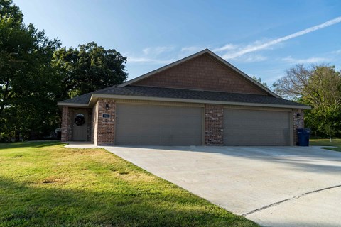 a house with a driveway and a garage door