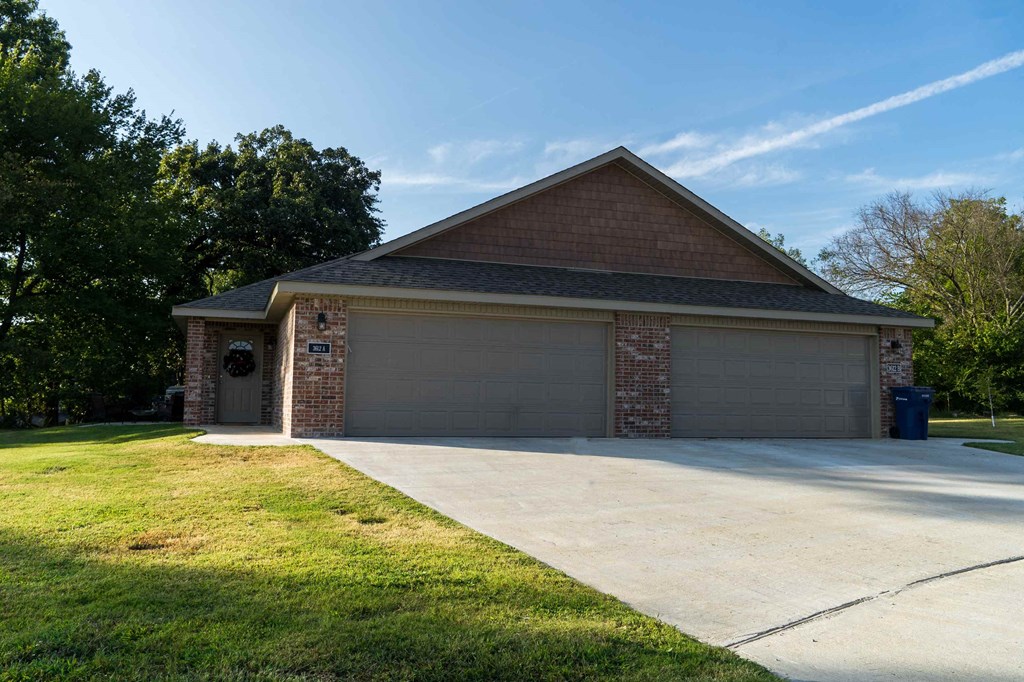 a house with a driveway and a garage door