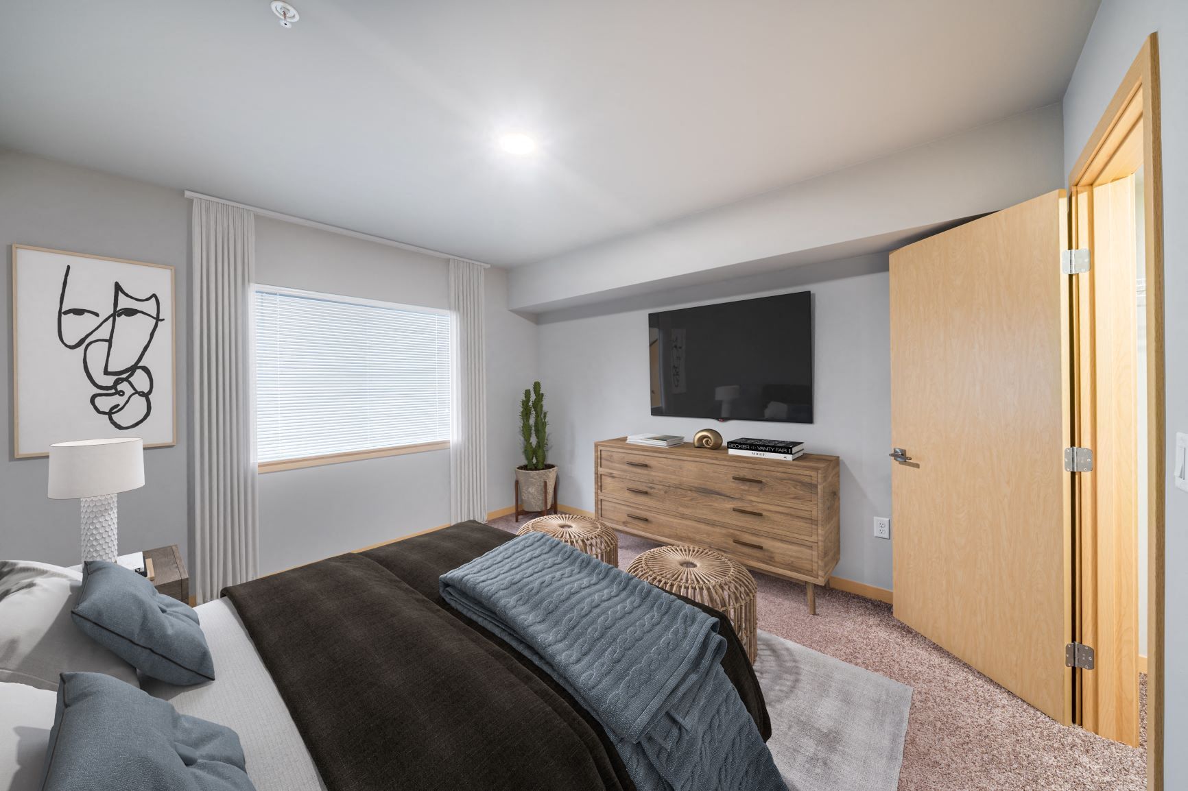 a bedroom with a bed and a tv