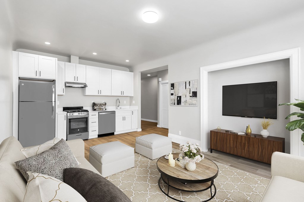 A modern living room with a grey couch and a coffee table.