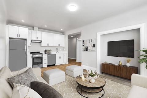 A modern living room with a grey couch and a coffee table.