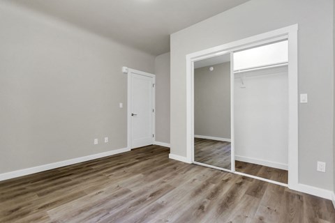 A room with a white door and a window.