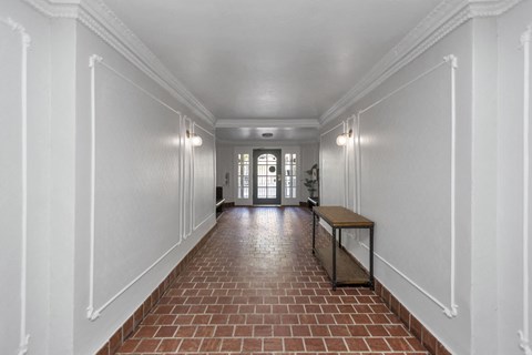 A long corridor with a bench at the end.