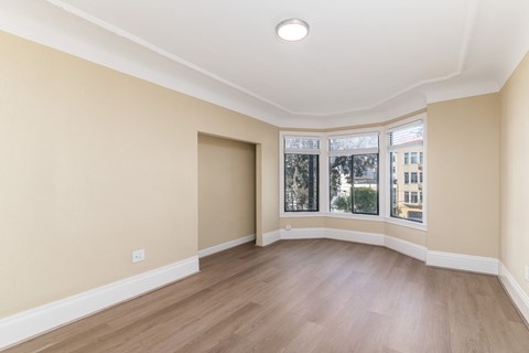 A room with a window and a door.