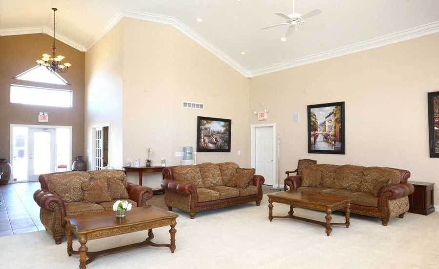 a living room with couches and a table