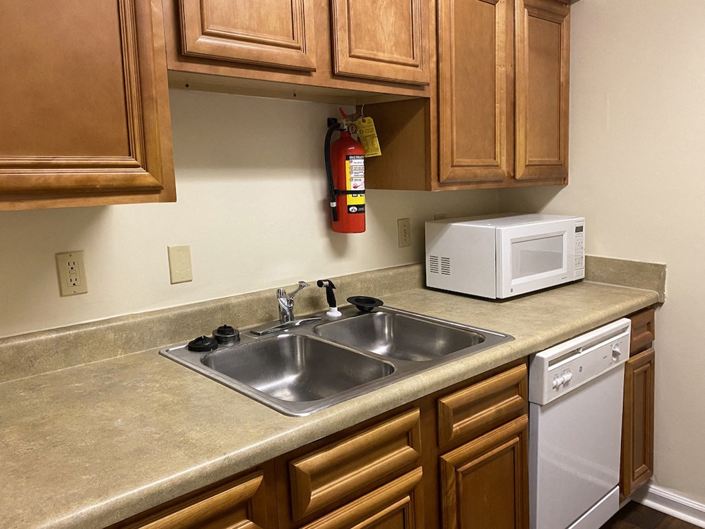 stainless steel sink and fire extinguisher in kitchen
