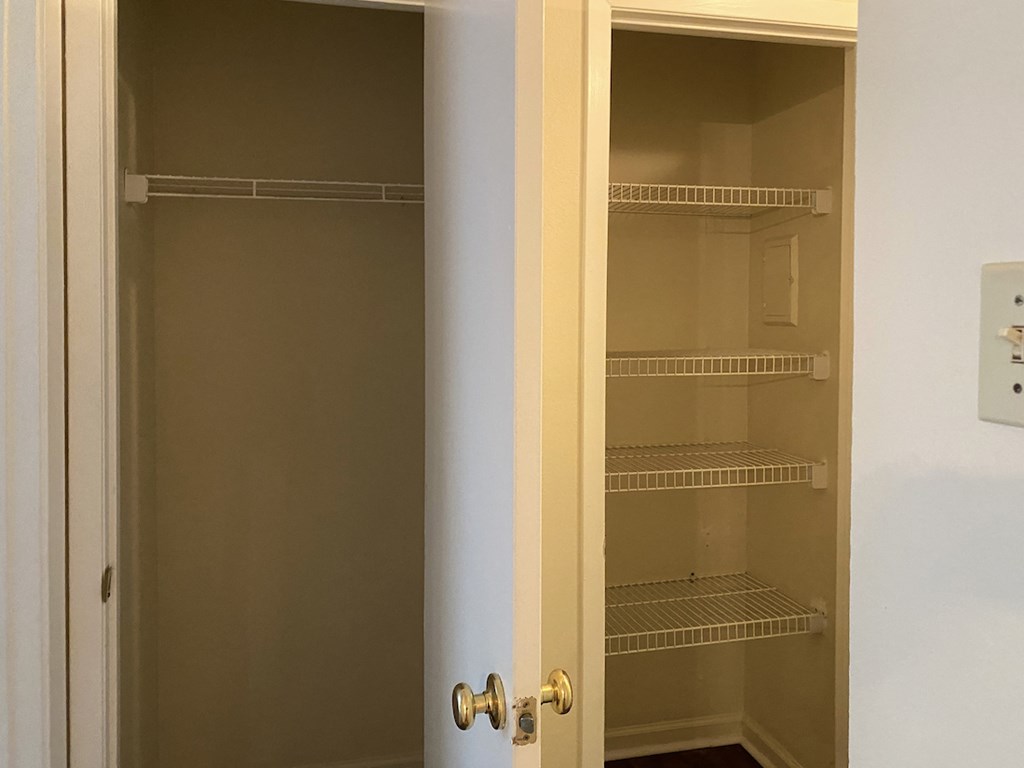closet and linen closet with built-in wire shelving