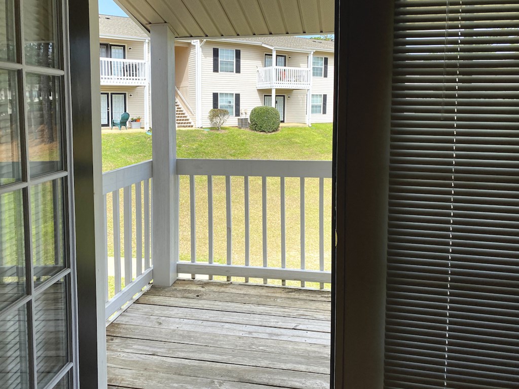 double doors leading to private deck overlooking community