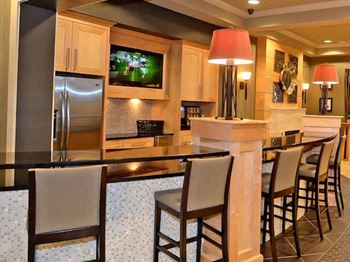 Complimentary coffee bistro with seating at Fenwyck Manor Apartments, Virginia, 23320