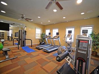Fitness center with cardio and strength training equipment at Fenwyck Manor Apartments, Chesapeake, VA, 23320