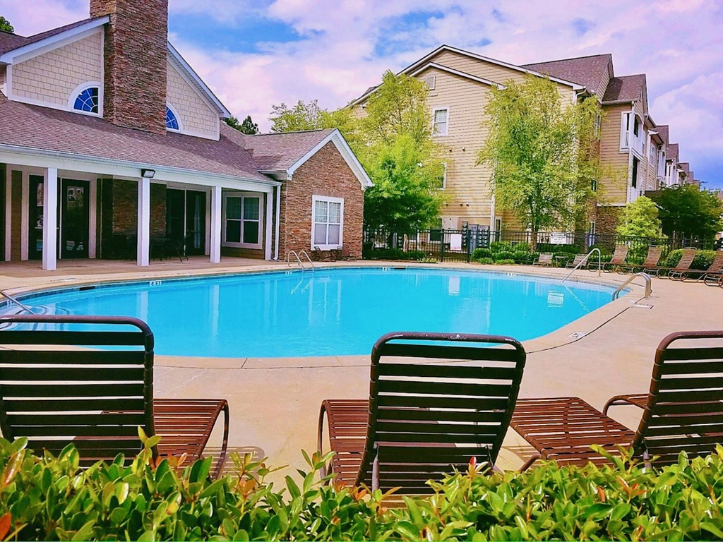 The sparkling pool and large sundeck by the clubhouse at Lumpkin Park Apartments