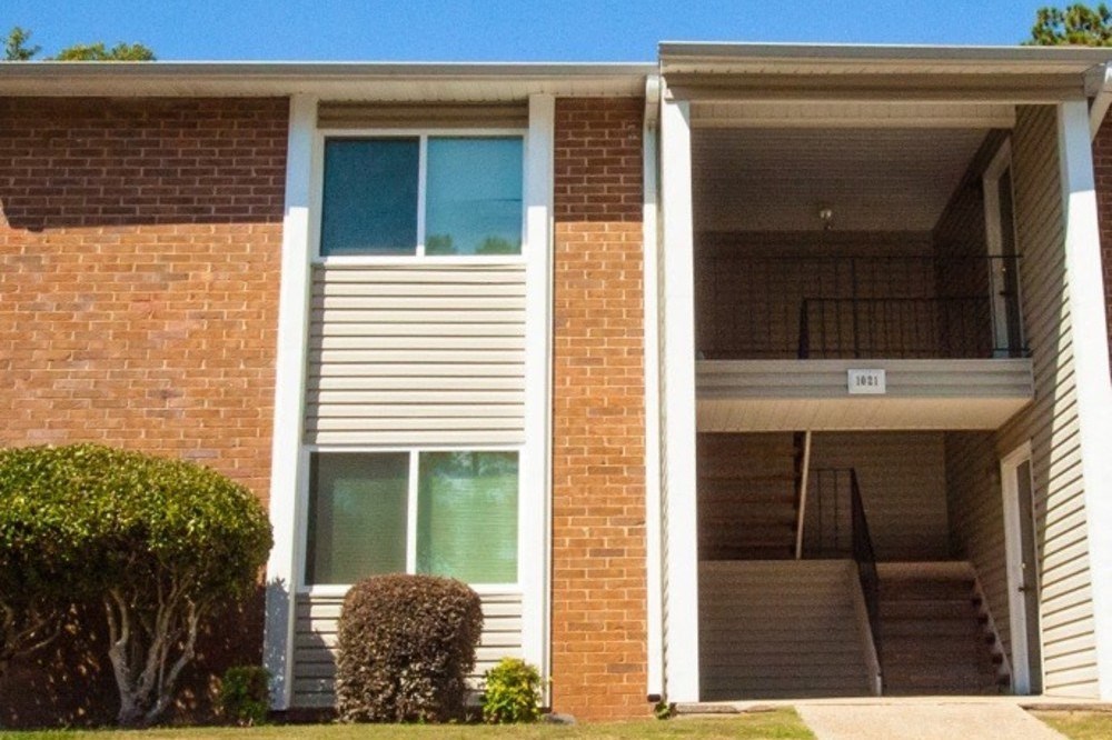 brick and siding exterior of apartment building
