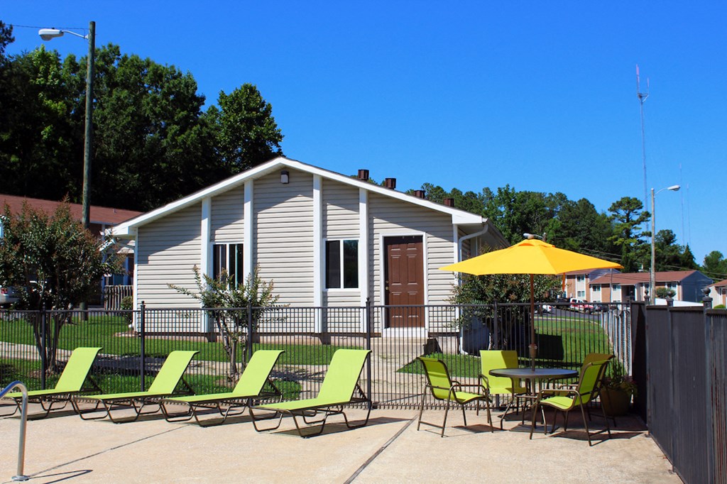 pool deck furnishings with clubhouse in background