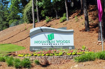 new sign new entrance signage with landscaping and flags - Photo Gallery 5
