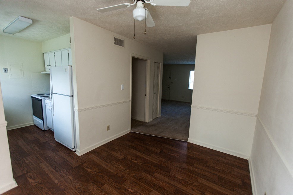 hardwood-style flooring in kitchen and dining area