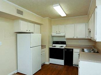 kitchen with efficient appliances and hardwood-style floors