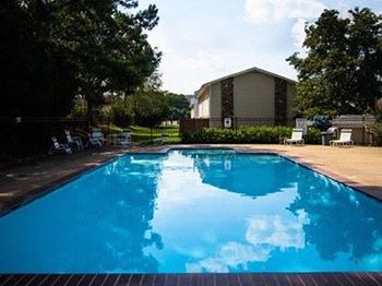 swimming pool with sundeck at Shadowood Apartments