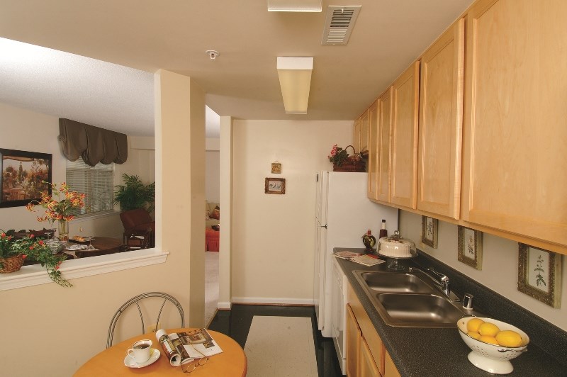 a small kitchen with a sink and a table