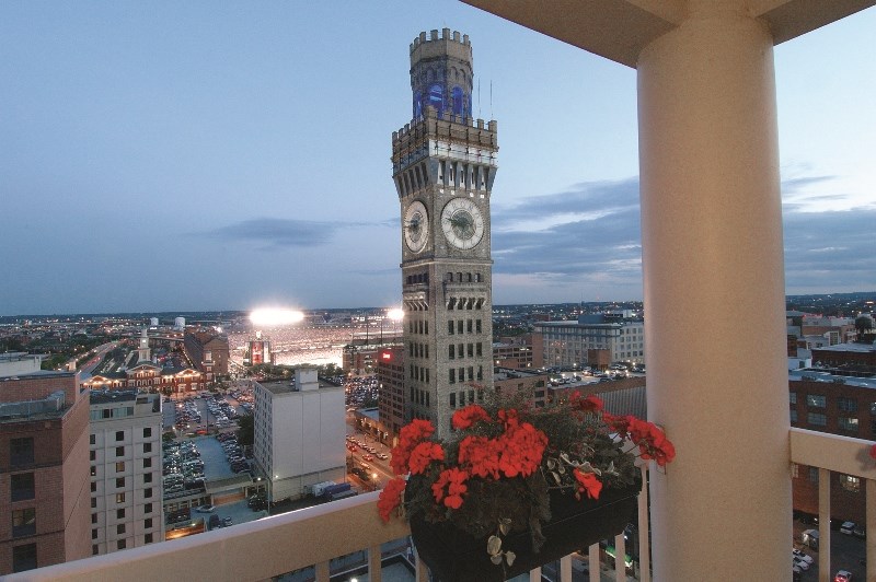 a view of the clock tower from a balcony