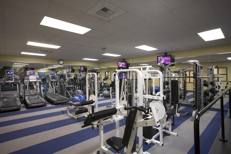 a gym with a lot of exercise equipment